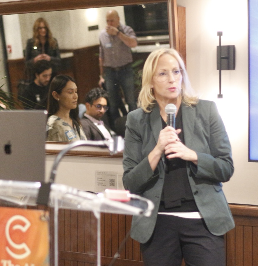 Paula speaking with a mic